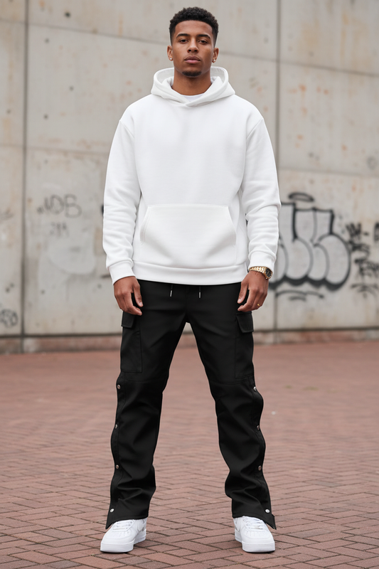 Front-facing angle of model in black cargo pants