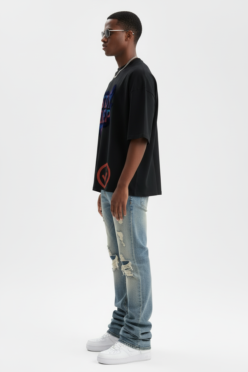 Left side view of model in Stay Deep tee