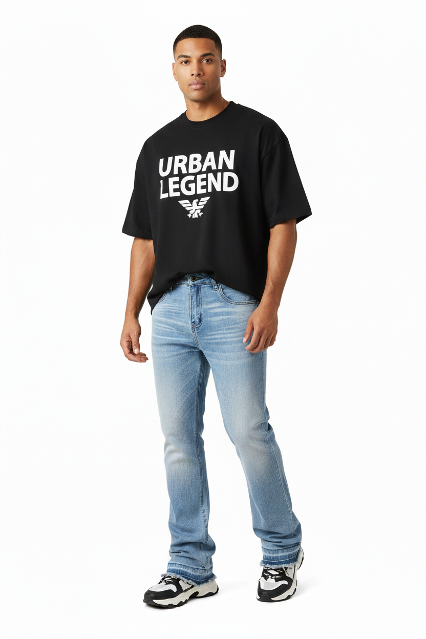 Male model wearing baggy jeans with slightly cropped designer tee