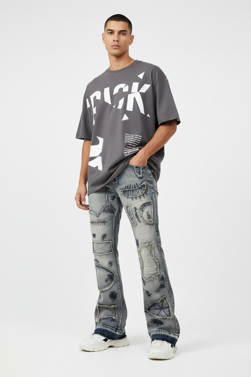 Slim model wearing wide flare distressed jeans with streetwear